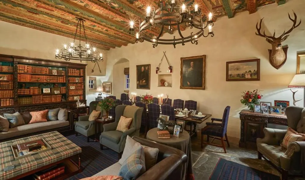 a living room filled with furniture and a chandelier at The Fortalice in Tulchan