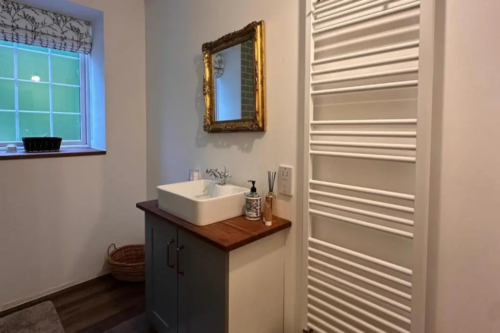 a bathroom with a sink and a mirror at Pets - Garden - Parking - Sleeps 2 - Hiking in Banchory