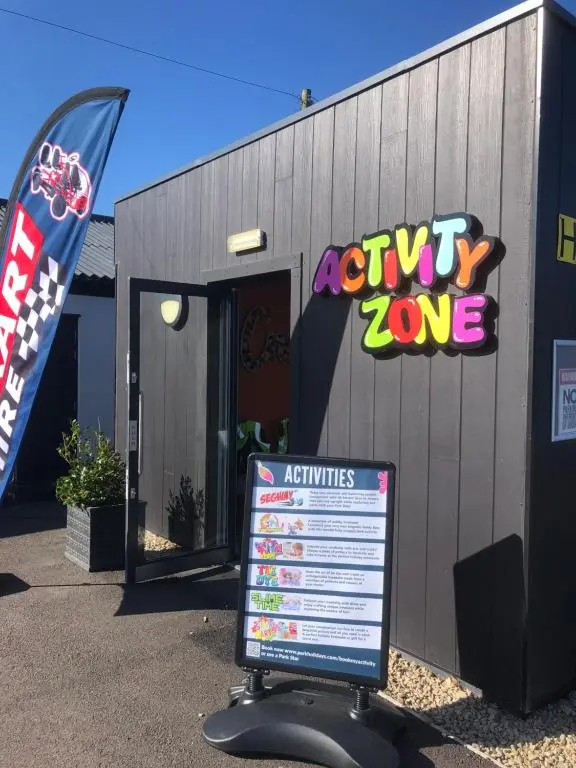 a sign in front of a building with a exitlove sign at Dunes Escape in Lossiemouth