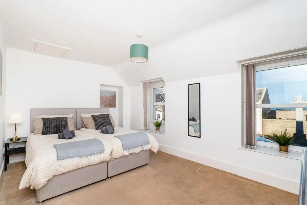 a bedroom with a bed and a window at Charming 1-Bed Coastal Cottage by Holiday Homes in Portgordon