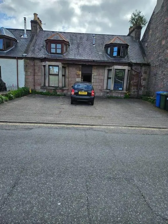 a car parked in front of a brick house at Flat 3/2 Murray Place Haugh Rd Inverness IV2 4SH in Inverness