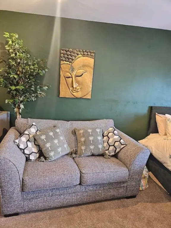 a living room with a couch with pillows on it at Flat 4 /2 Murray Place Haugh Rd Inverness IV2 4SH in Inverness