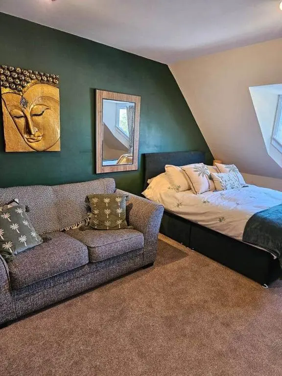a living room with a couch and a bed at Flat 4 /2 Murray Place Haugh Rd Inverness IV2 4SH in Inverness