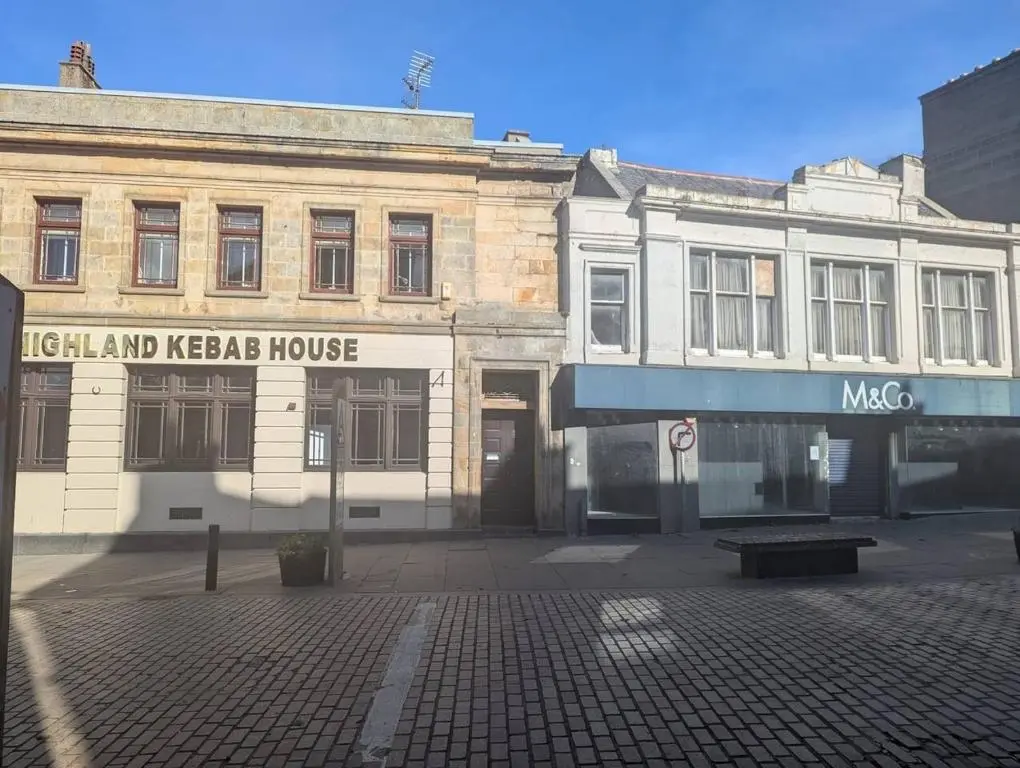 an old building on the corner of a street at Bankside - 1 En-Suite in Central - Free Parking in Wick