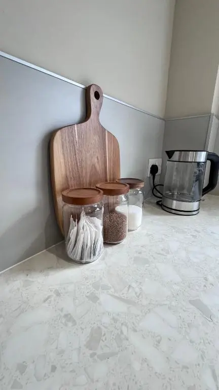 a kitchen with three glass jars on a counter at No 67 West Road in Fraserburgh