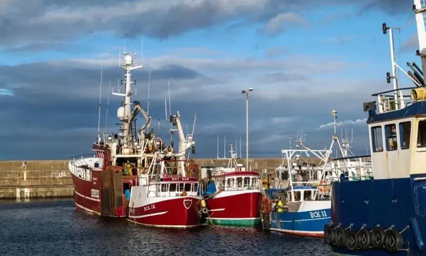 a group of boats parked in the water at Buckie Central 2 Bed Retreat in Buckie