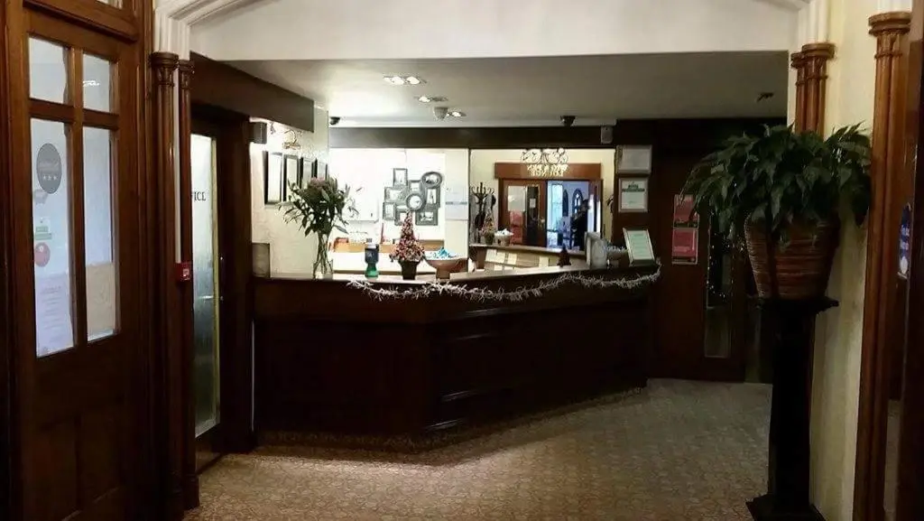 a lobby with a large mirror in a building at The Royal Hotel Tain in Tain
