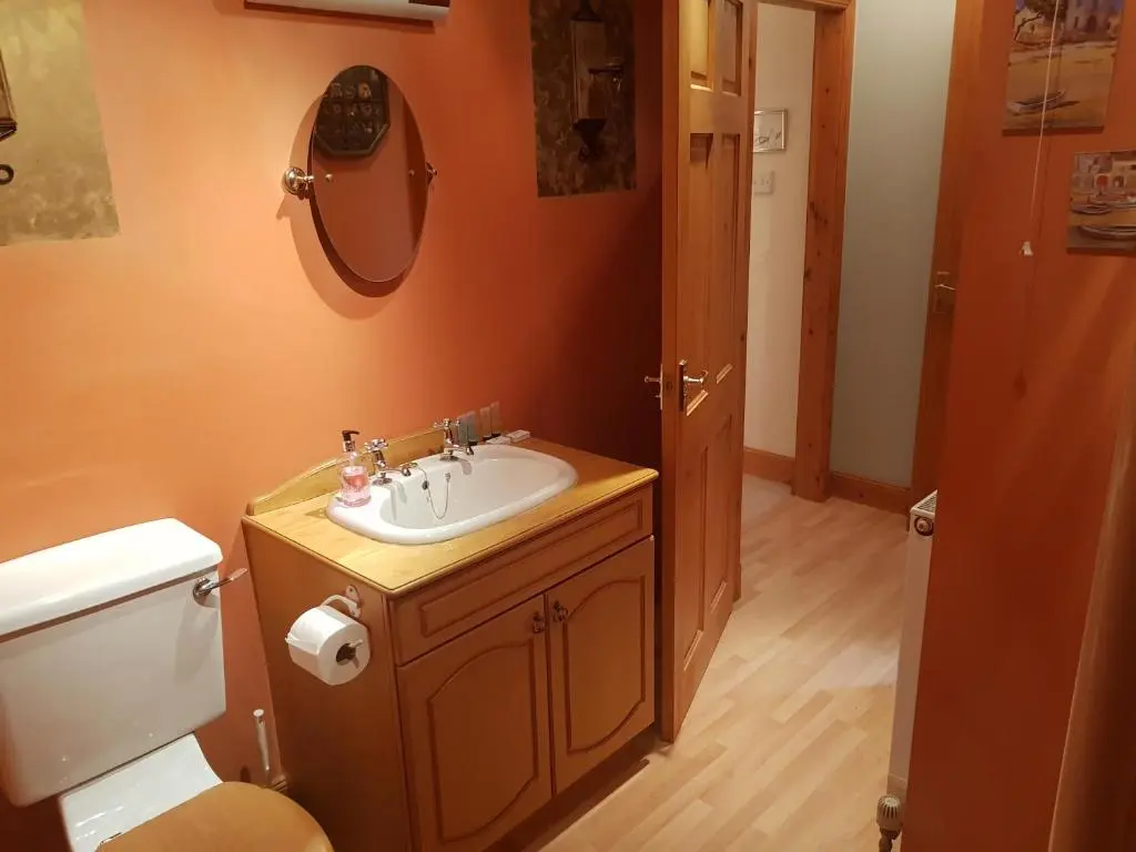 a bathroom with a sink and a toilet at Hosefield Bed and Breakfast in Ellon