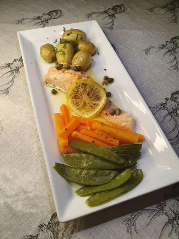 a plate of food with carrots and vegetables on a table at Kintrae B&B in Buckie
