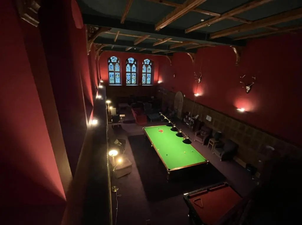 an overhead view of a room with a green table at The Classrooms, Loch Ness Abbey - 142m2 Lifestyle & Heritage apartment - Pool & Spa - The Highland Club - Resort on lake shores in Fort Augustus
