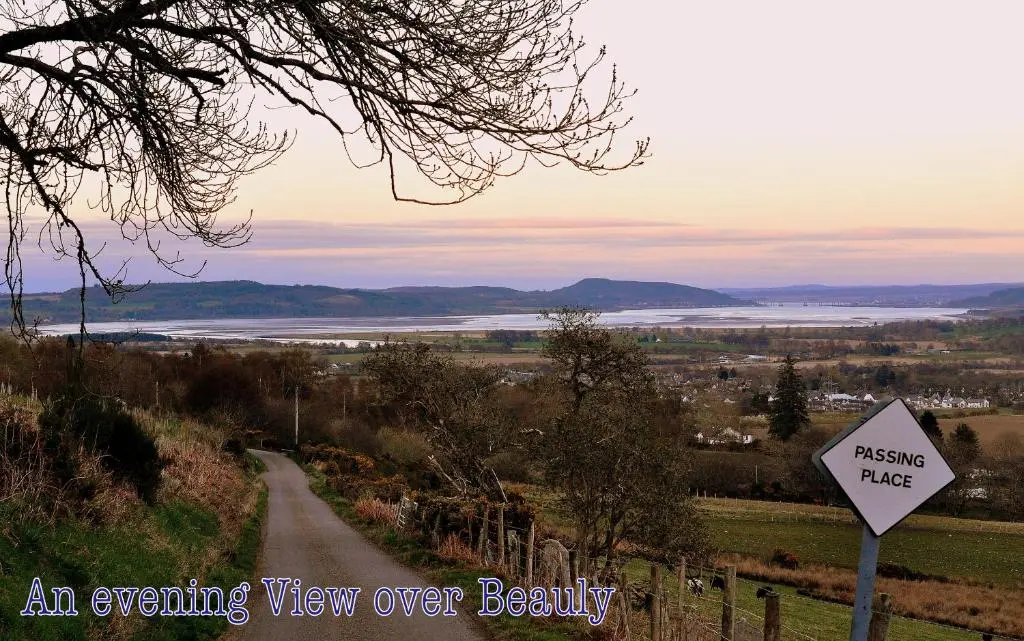an evening view of a view over a body of water at Ornum Cottage in Beauly