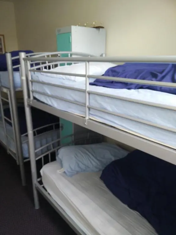 a group of bunk beds in a room at The Smugglers Hostel in Tomintoul