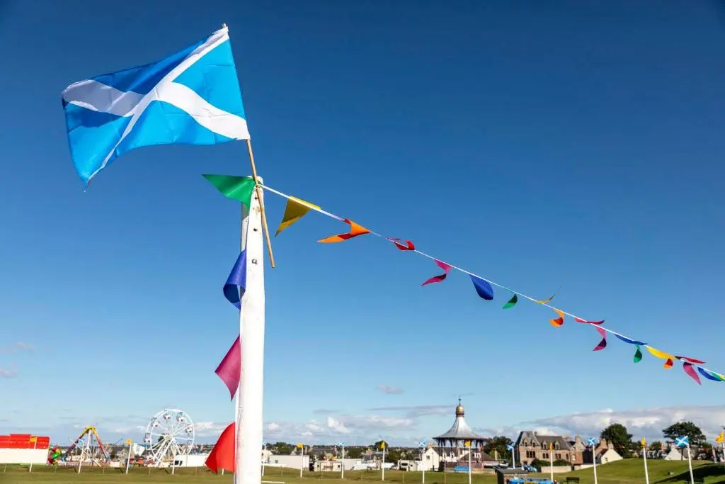 a flag and flags on a pole in a park at Cawdor House B&B in Nairn