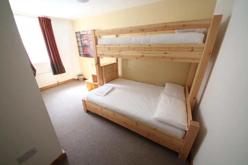 a bedroom with two bunk beds in a room at Black Isle Bar & Rooms in Inverness