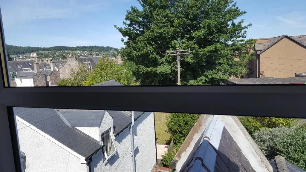 a view from a window of a church at Dunskaith Villa in Inverness