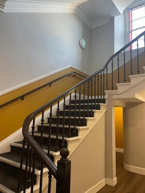 a spiral staircase in a home with a stair case at Luxury Apartment at Barron House in Nairn