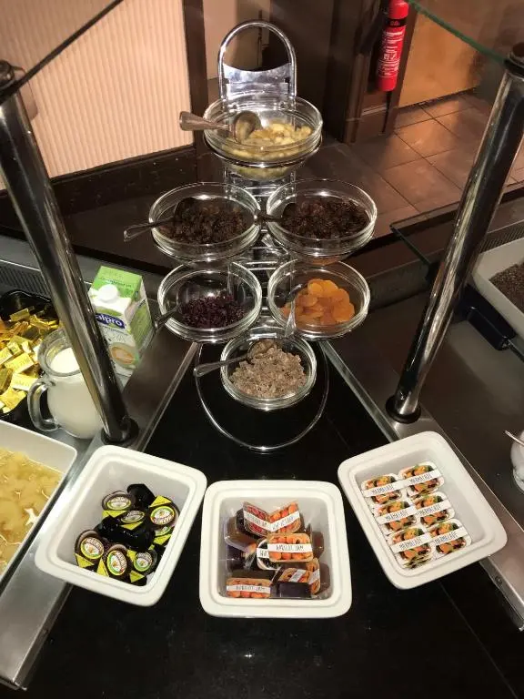 a table with trays of different types of food at Ben Wyvis Hotel in Strathpeffer