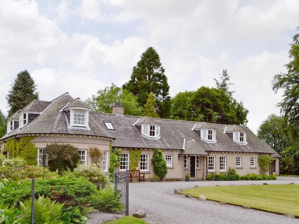 an exterior view of a house with a garden at Little Blackhall Lodge in Banchory