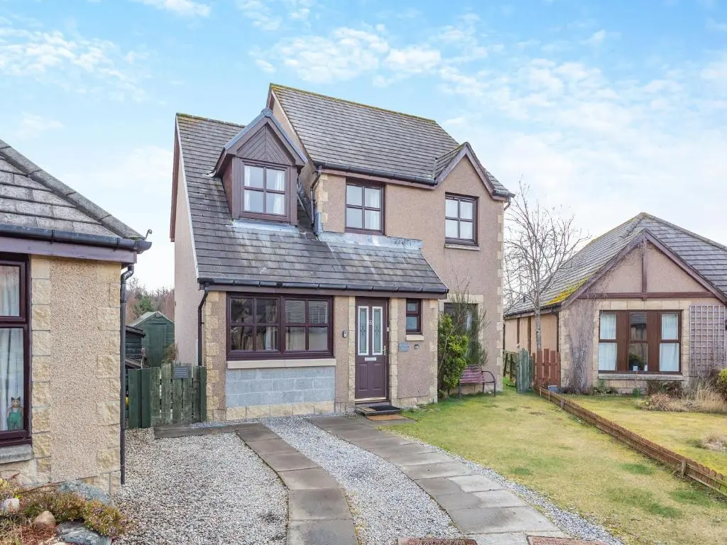 a house with a driveway in front of it at Cairnie View in Aviemore