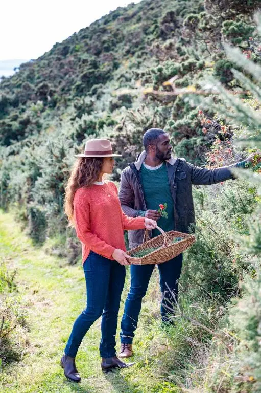 a man and a woman standing on a hill at The Glenmorangie House in Tain