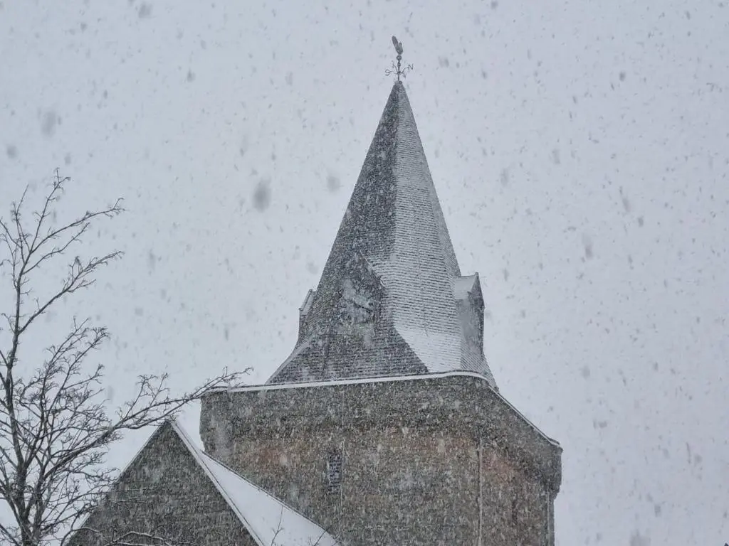a steeple of a building with a clock on it at Balloan House in Dornoch