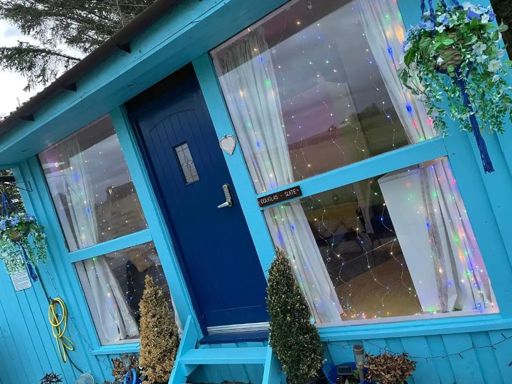 a blue house with a blue door and windows at Bankhead Accommodation Aberdeenshire in Gamrie