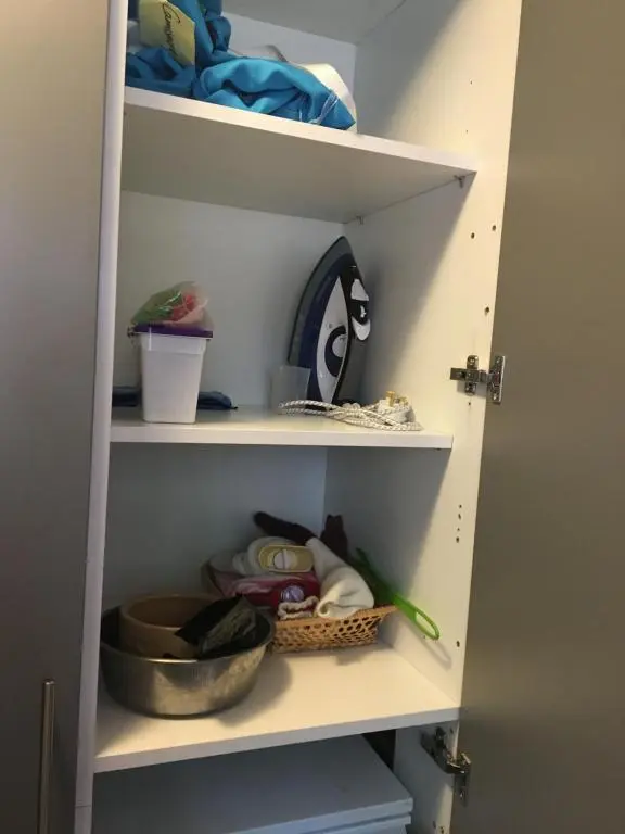 a shelf with bowls and other items on it at Camusmore House in Aviemore