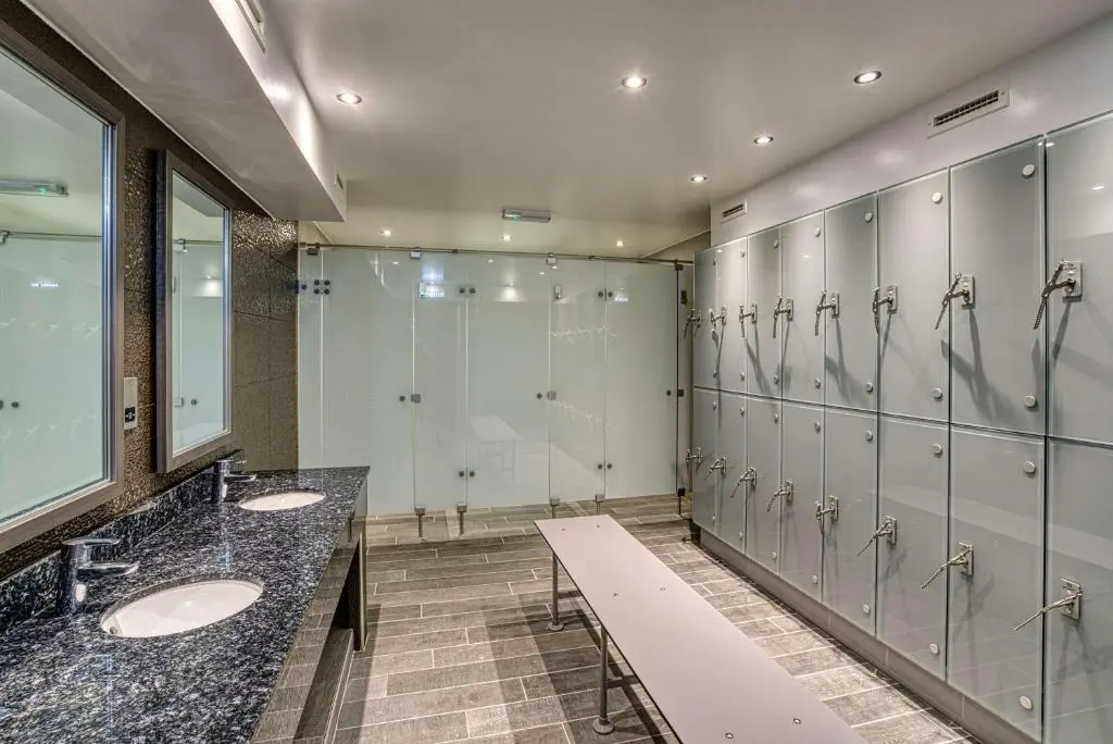 a bathroom with a row of sinks and mirrors at Inverness Palace Hotel & Spa, WorldHotels Distinctive in Inverness