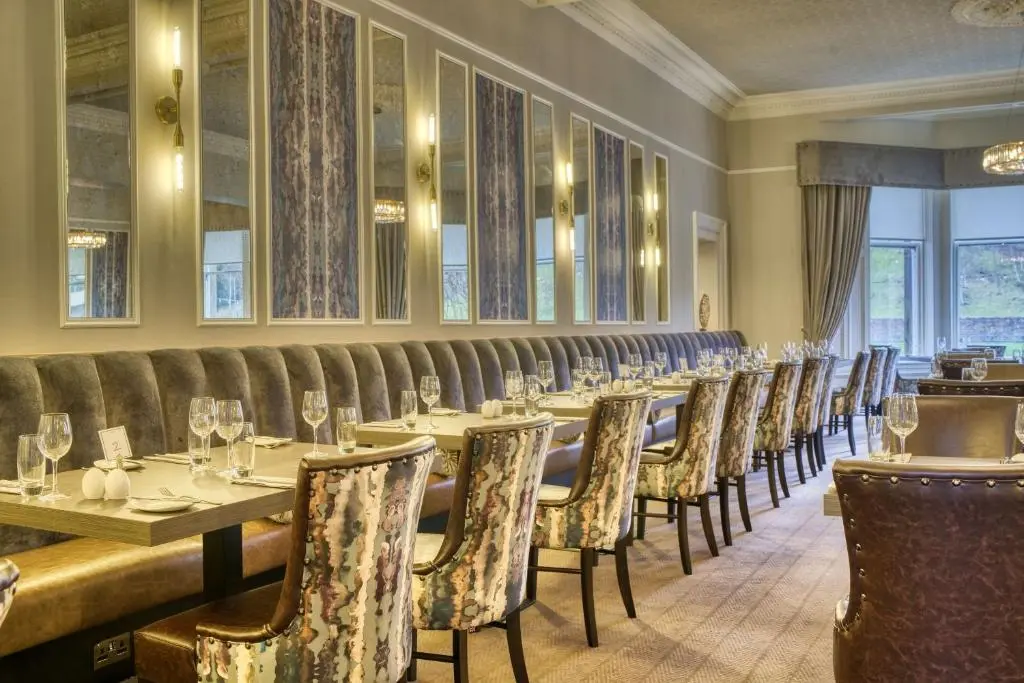 a row of tables and chairs in a restaurant at Inverness Palace Hotel & Spa, WorldHotels Distinctive in Inverness