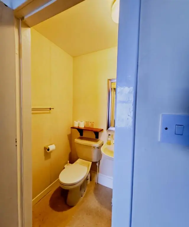 a bathroom with a toilet and a sink at The Station Hotel in Portsoy