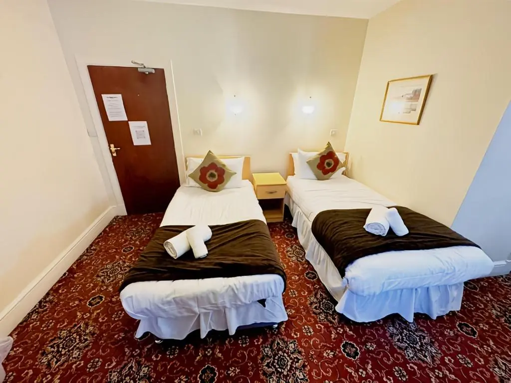 a hotel room with two beds in a room at The Station Hotel in Portsoy