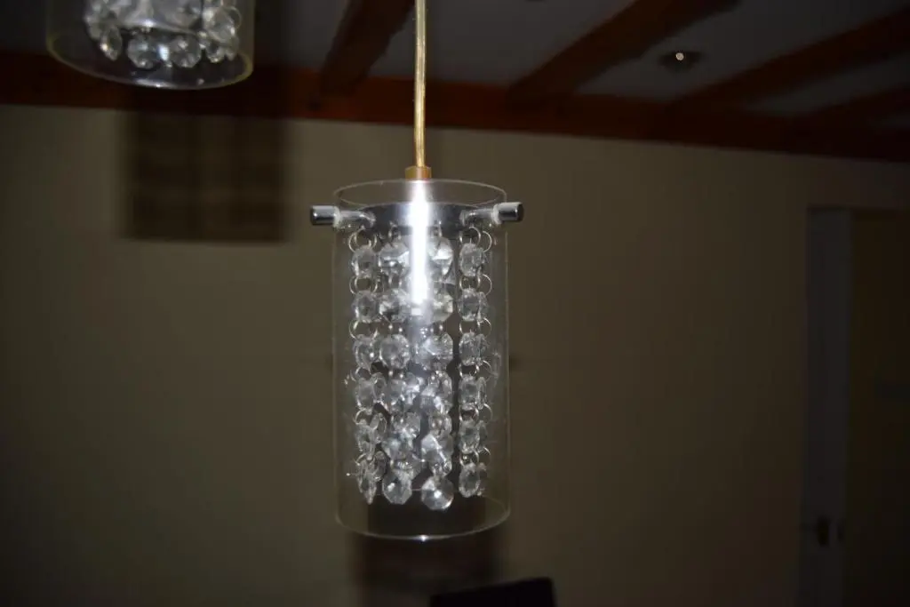a glass vase with a wooden stick in it at Amazing 4 Bed Scottish Baronial Style House in Westhill