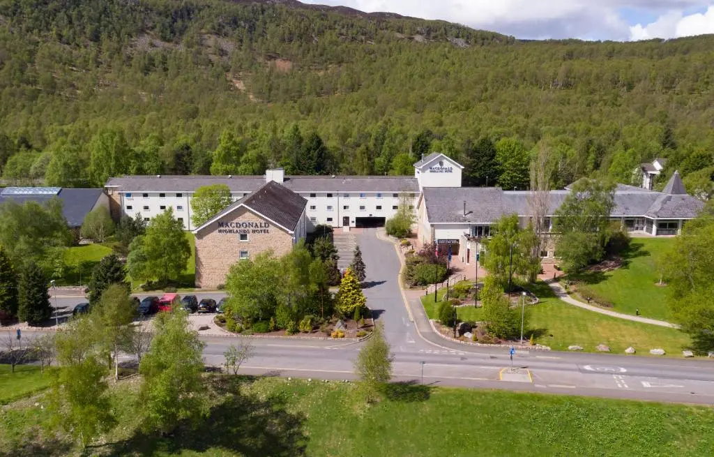 an aerial view of a town with a mountain at Macdonald Highlands Hotel at Macdonald Aviemore Resort in Aviemore