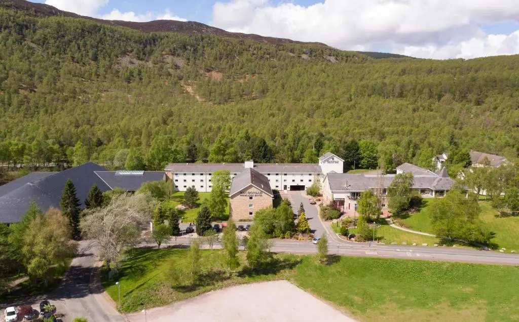 an aerial view of a house in a mountain at Macdonald Highlands Hotel at Macdonald Aviemore Resort in Aviemore