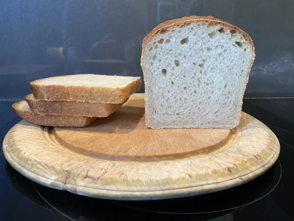 a loaf of bread on a cutting board with some bread at Washington House in Nairn