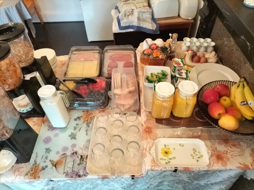 a table with a bunch of food on it at Talisker Guest House in Inverness