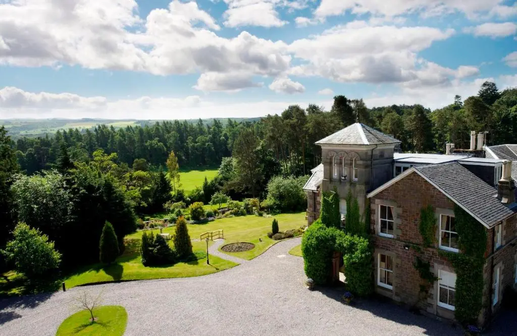 an aerial view of a house with a garden at Loch Ness Country House Hotel in Inverness