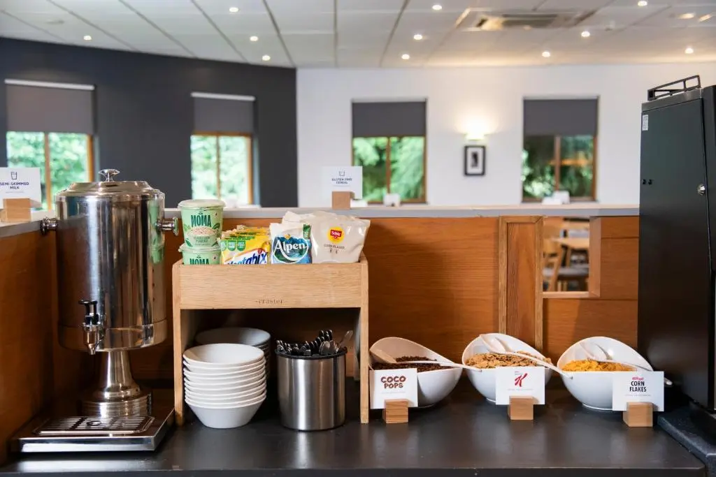 a kitchen with a counter with bowls of food at Holiday Inn Express Inverness by IHG in Inverness