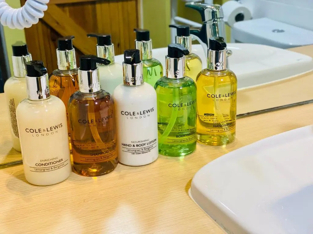 a group of bottles of soap on a table at Aultguish Inn in Garve