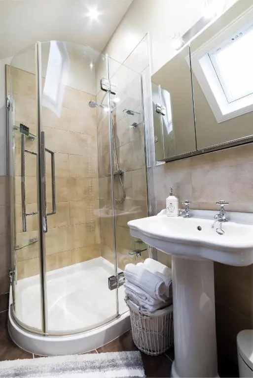 a bathroom with a shower and a sink at Kylelachin in Dingwall