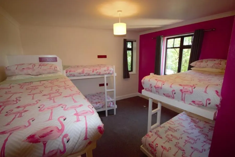 a bedroom with two beds and a window at Inverness Student Hotel in Inverness