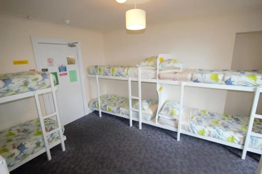 a room with four bunk beds in it at Inverness Student Hotel in Inverness