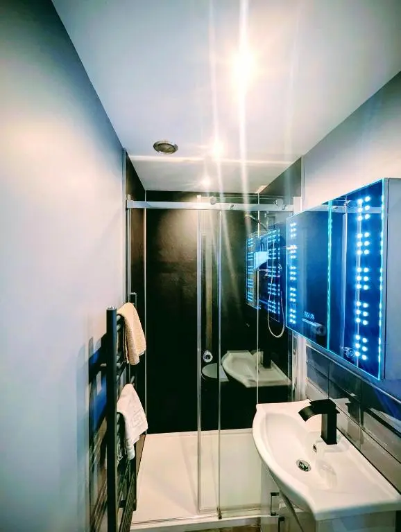 a bathroom with a shower and a sink at Whitehouse B&B in Fort Augustus