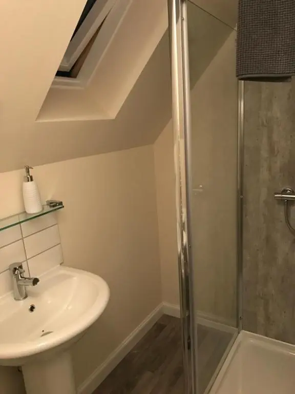 a bathroom with a sink and a shower at View Cottage in Inverness