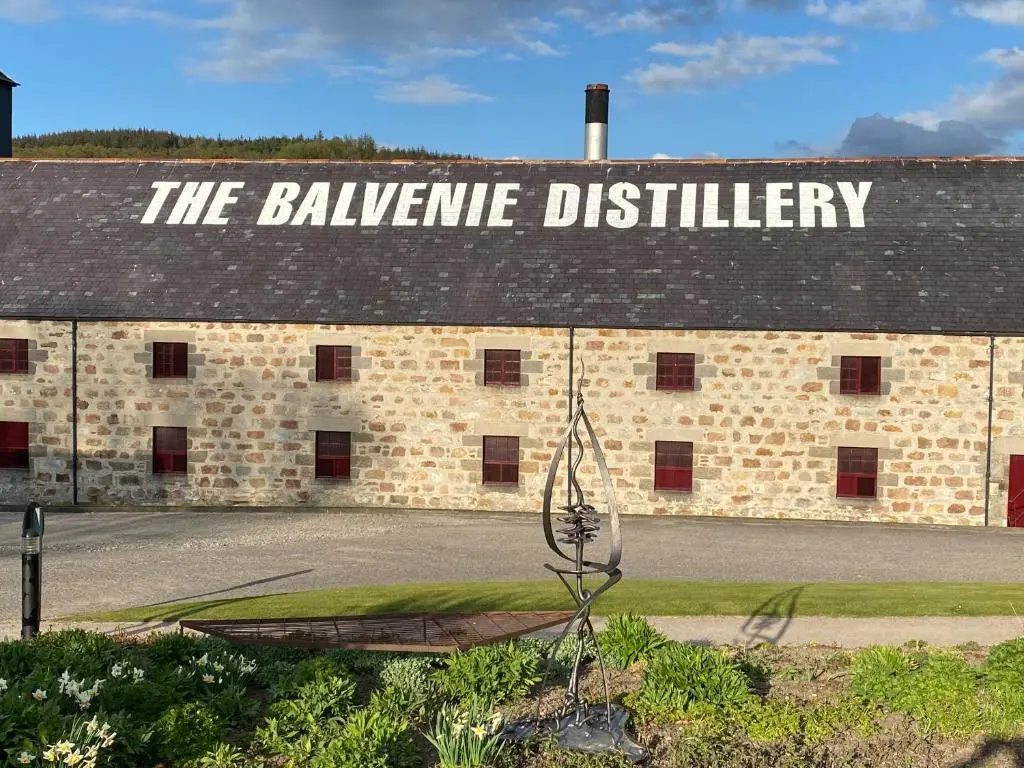 a building with a sign on the side of it at The Coffee Pot accommodation in Dufftown