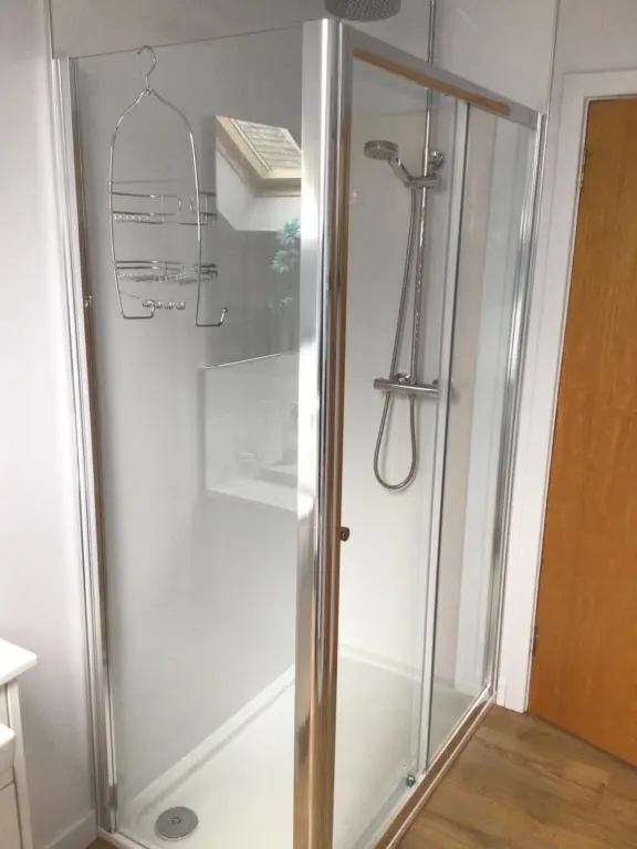 a shower with a glass door in a bathroom at The Coffee Pot accommodation in Dufftown