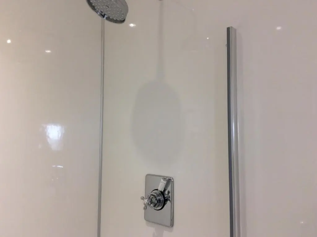 a shower in a bathroom with a glass door at Rudan Guest House AB53 6UQ in New Deer