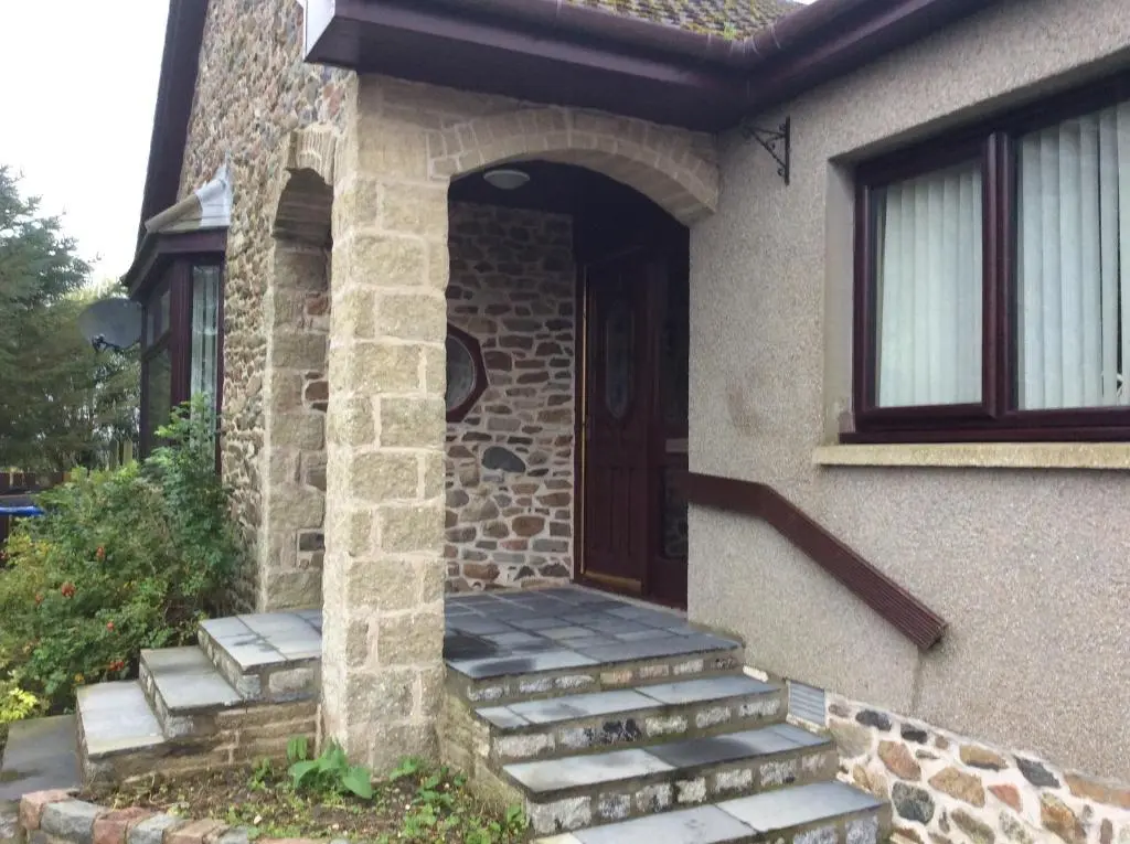 a front door of a house with stairs leading to it at Rudan Guest House AB53 6UQ in New Deer