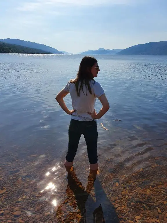 a woman standing in a body of water at Doric House in Inverness