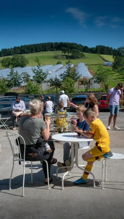 a group of people sitting at a table at The Lodges @ Barra Castle in Inverurie